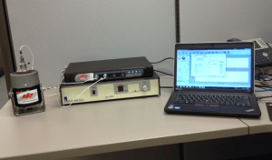 Accelerometer calibration setup with shaker, amp, accelerometers, controller, computer