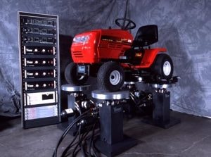 lawn mower on a four-post shaker system