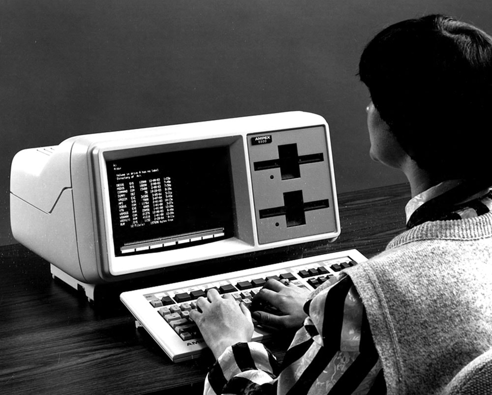 Man using an Ampex 6500 Workstation, a MS-DOS-based PC