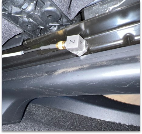 triaxial accelerometer attached to an automotive seat rail